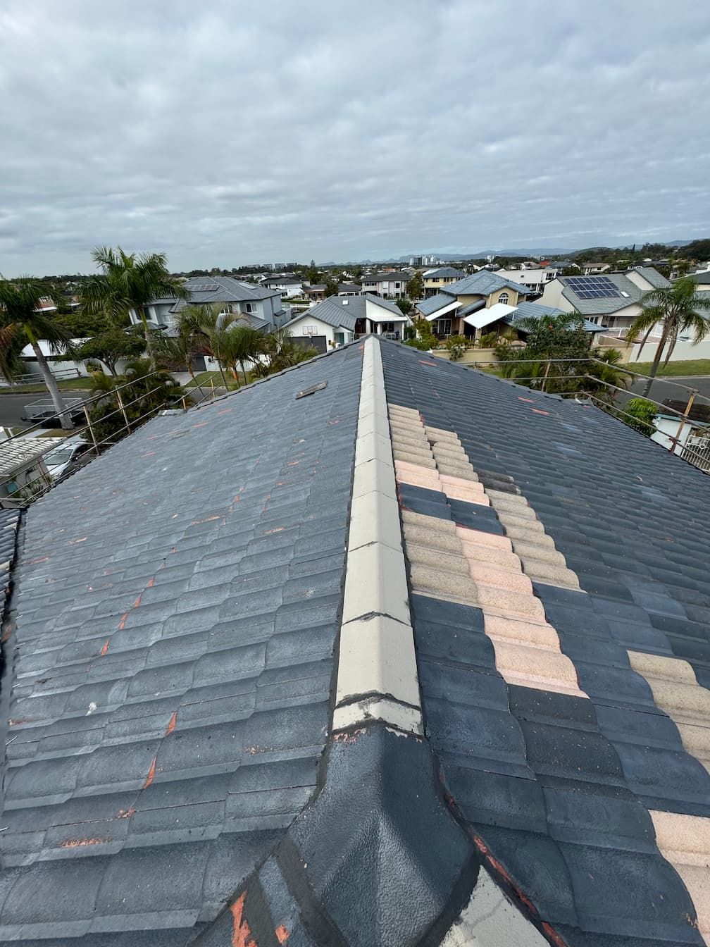 The roof of a house is being repaired and a gutter is being installed.