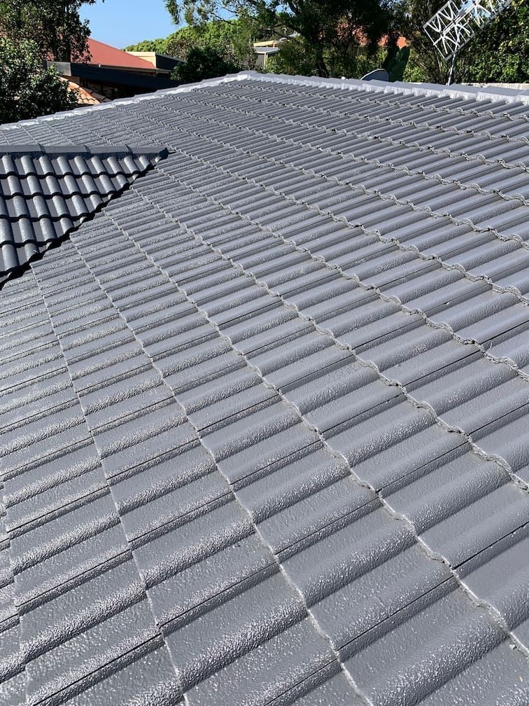 A close up of a roof with a lot of tiles on it.