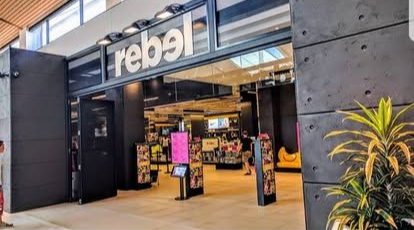 Rebel store entrance with a black exterior and large 