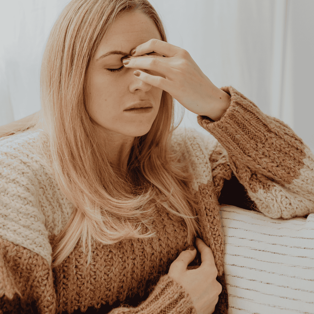  Woman closes and touches her eyes, asking 