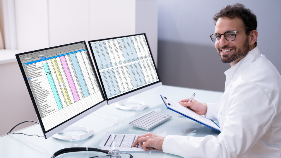 Clinic staff member uses a practice management system to ensure billing and coding accuracy.