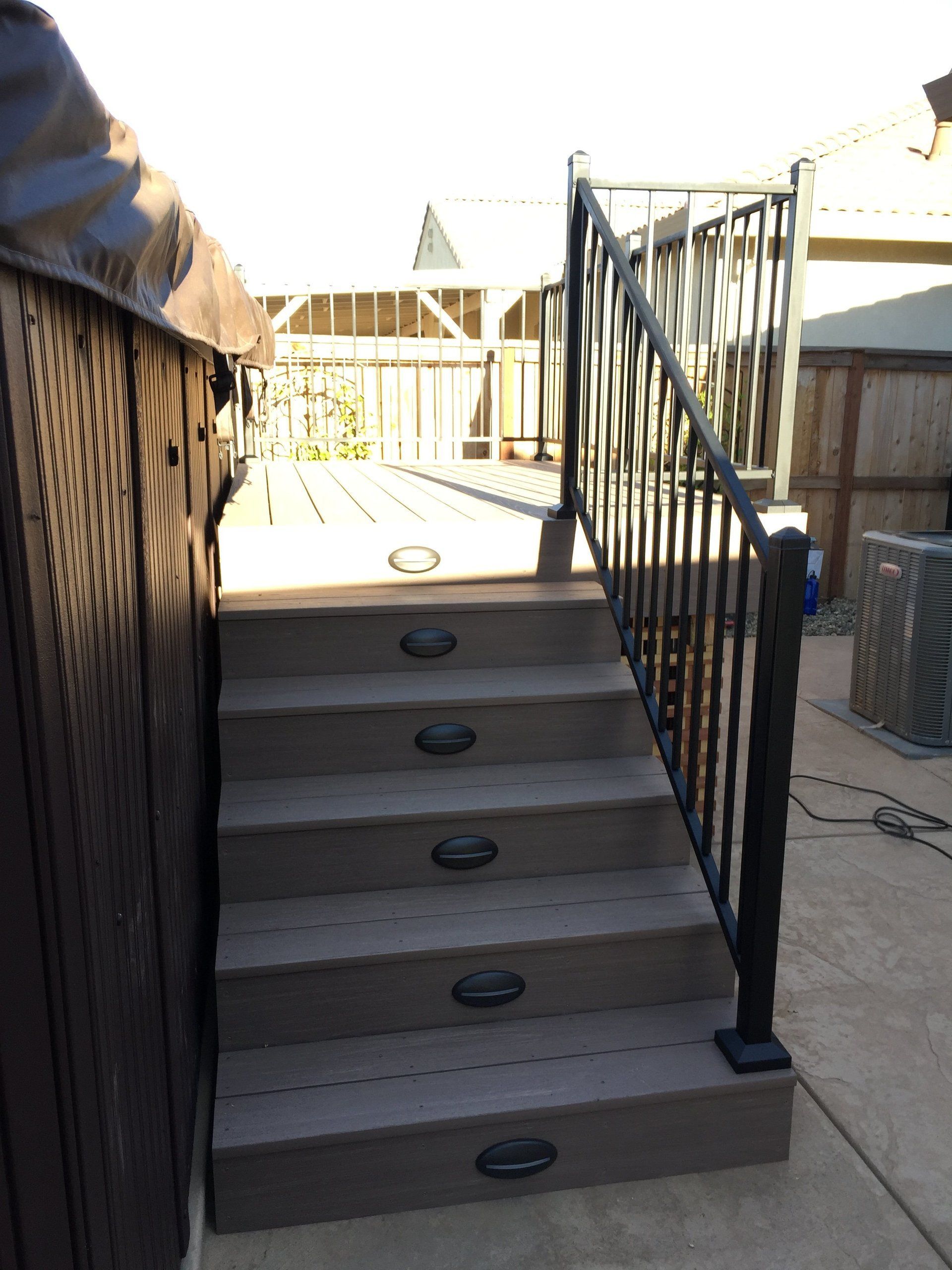 A set of stairs leading up to a hot tub