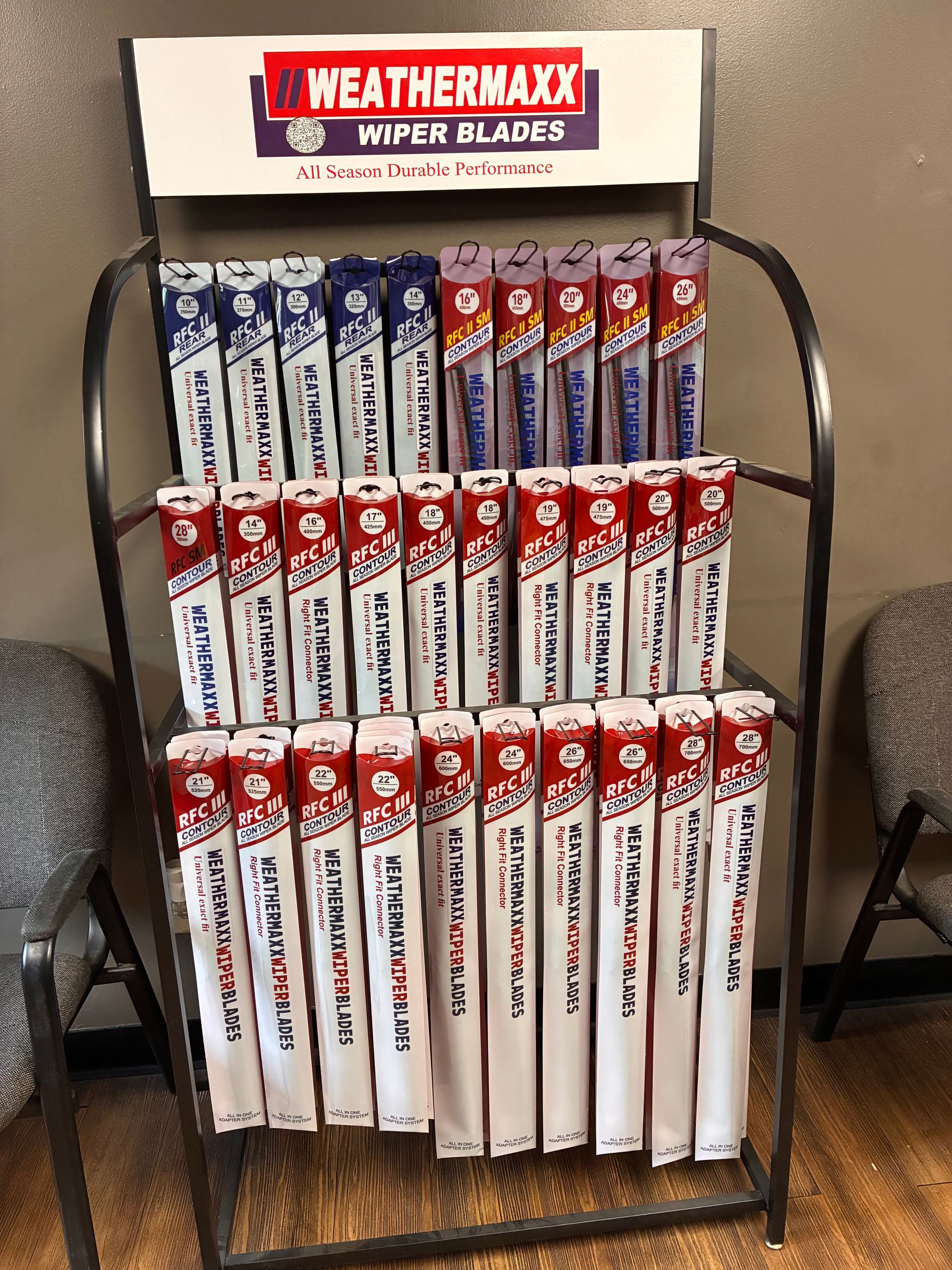Store display rack with Weathermax Wiper Blades boxes in red, white, and blue packaging