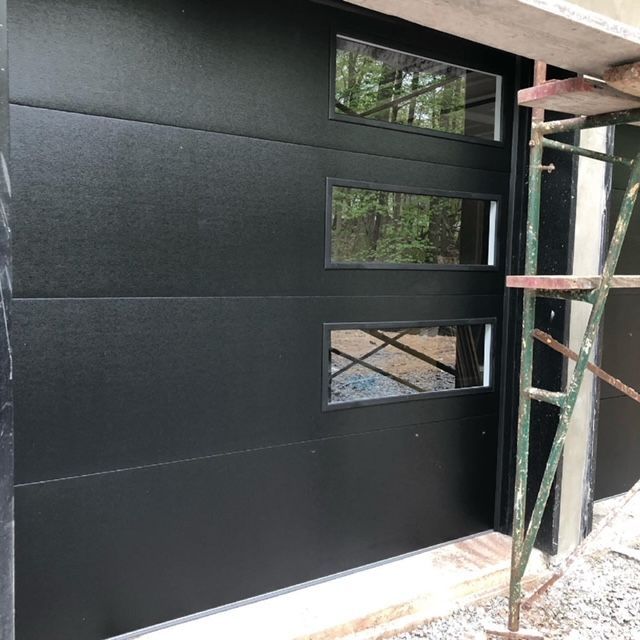 Black garage door with window details