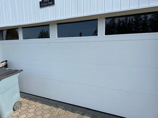 Classic white garage door with window details