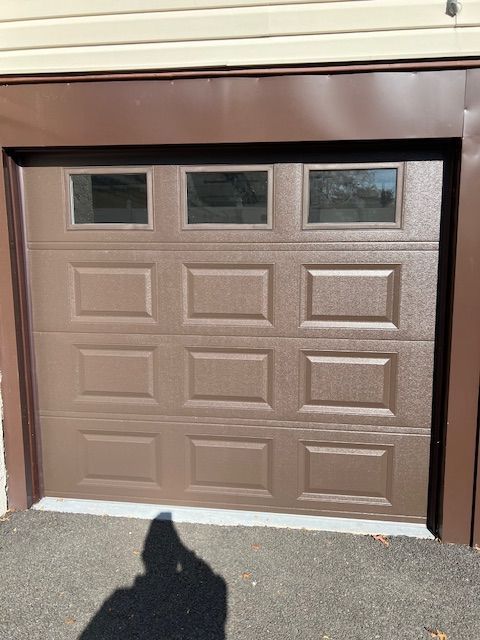 Brown garage door with windows