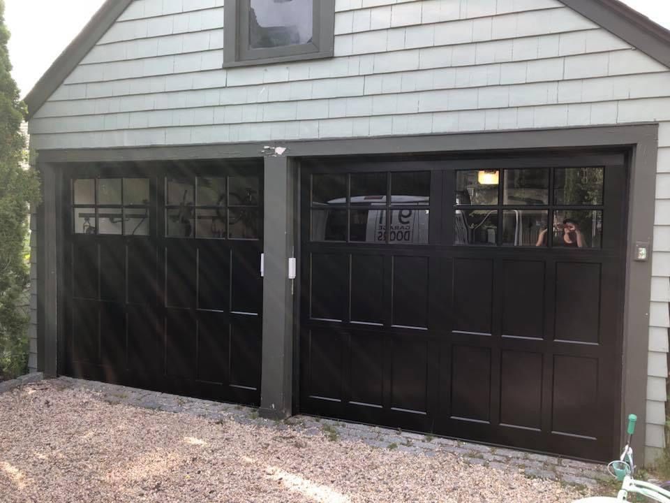 Two paneled black garage doors