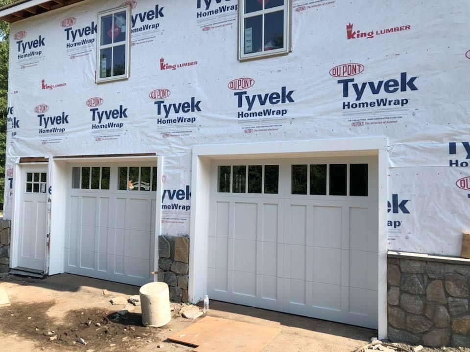Two white garage doors installed for a new home