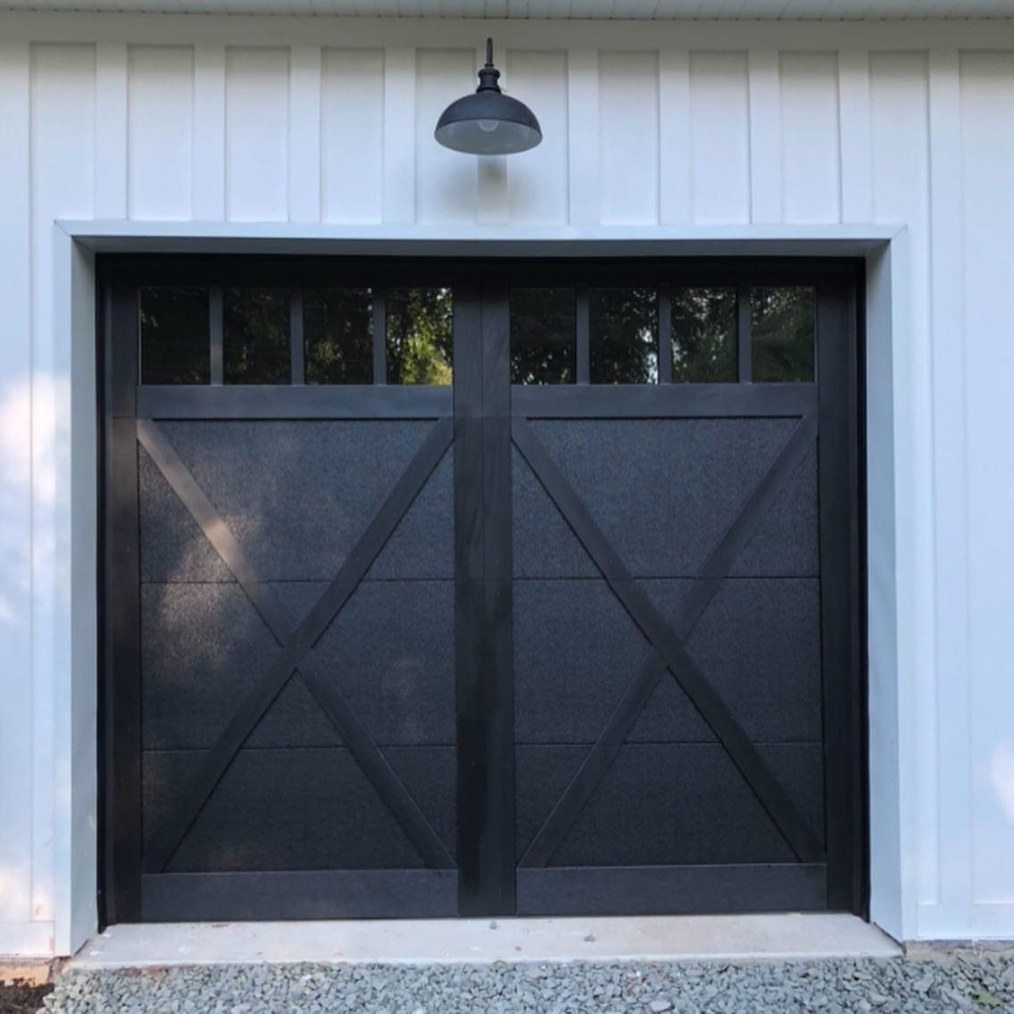 Paneled black garage door