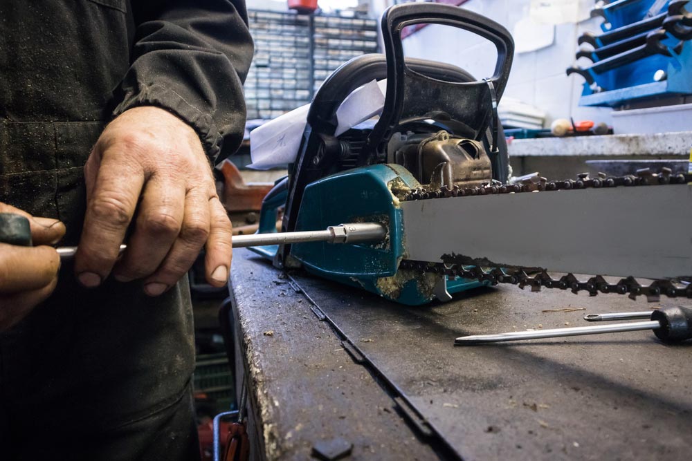 Chainsaw Being Serviced — Coffs Chainsaw and Mower in Coffs Harbour, NSW