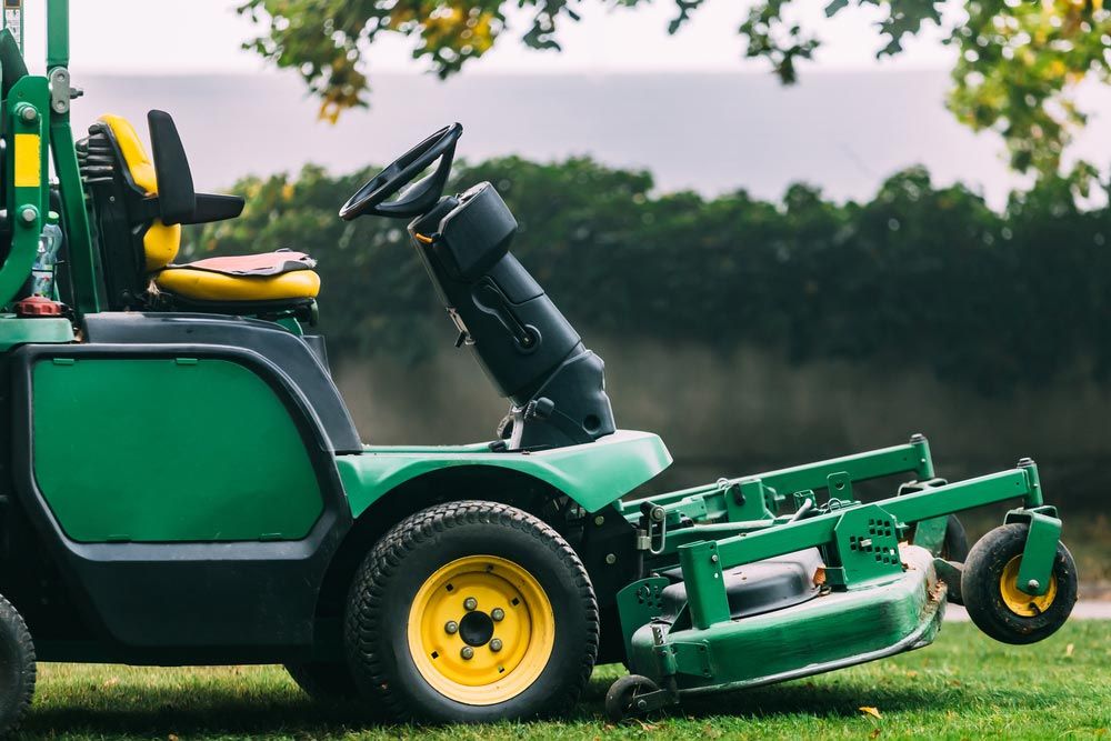 Ride On Lawn Mower On Green Grass — Coffs Chainsaw and Mower in Bellingen, NSW