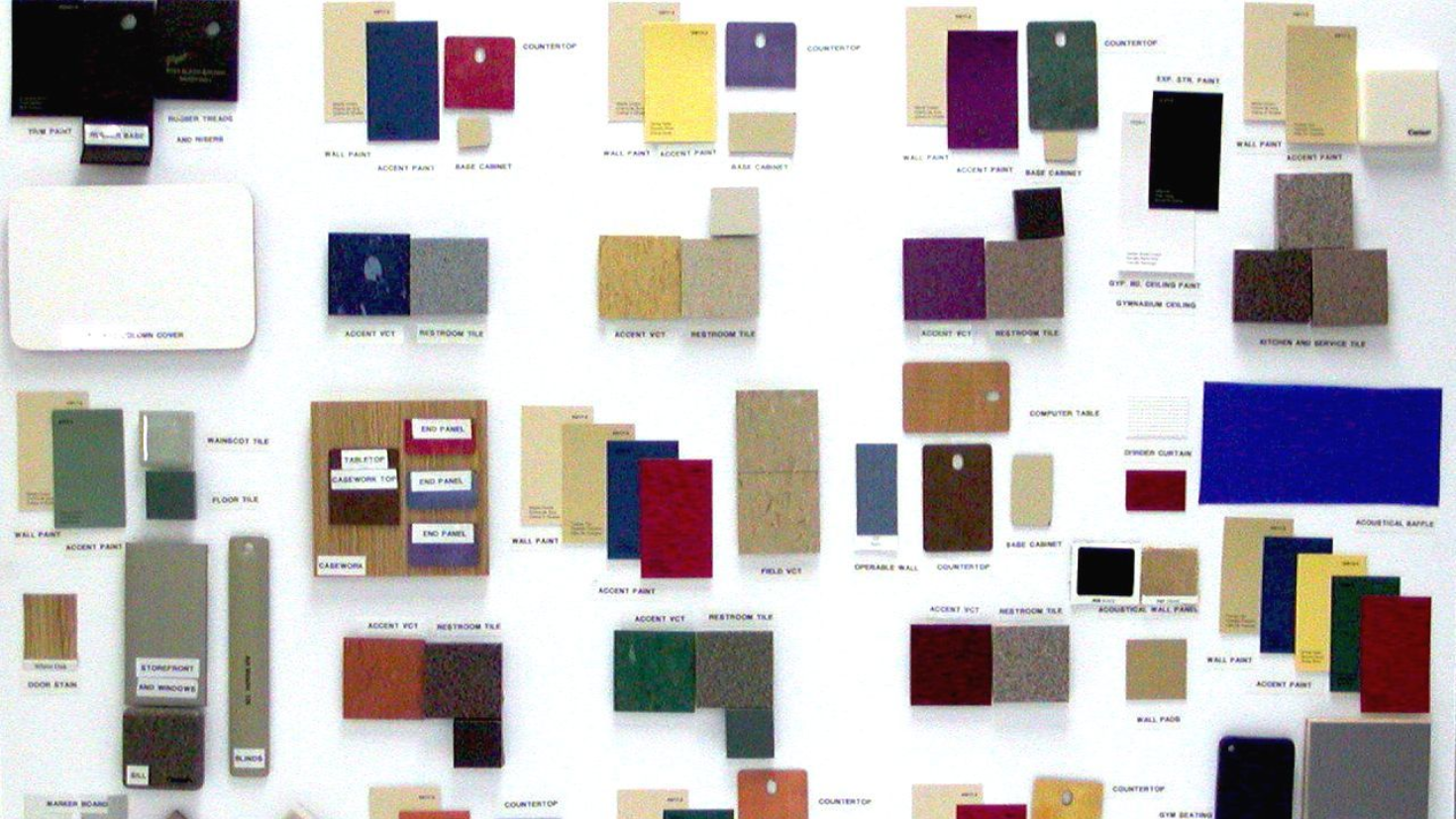 Color swatches of various shapes and sizes, arranged on a white board.