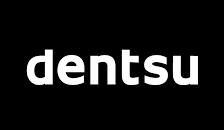 White “dentsu” logo on a black background.