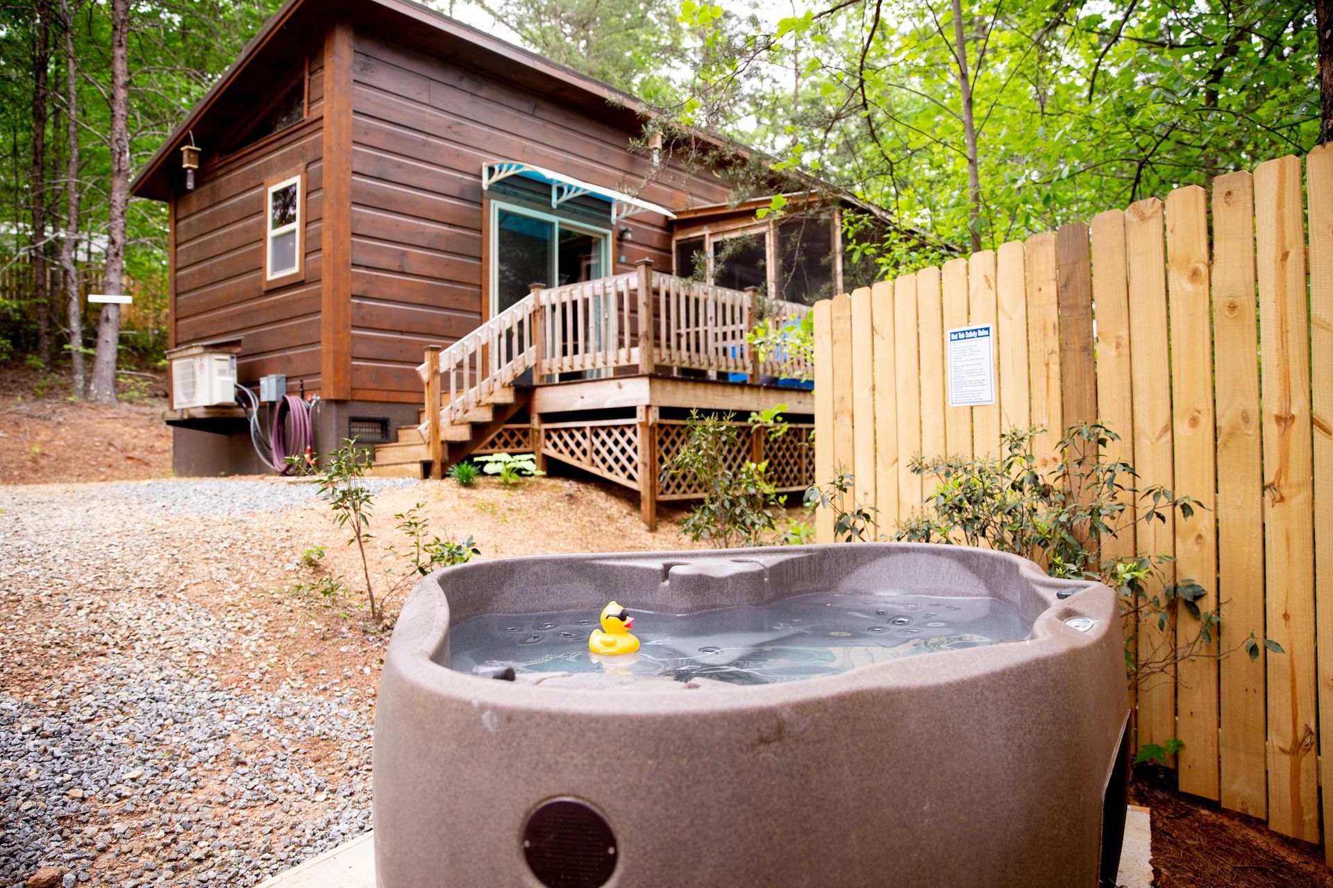 Cabin A exterior with private hot tub for wedding guests at Serenity Ridge North Carolina