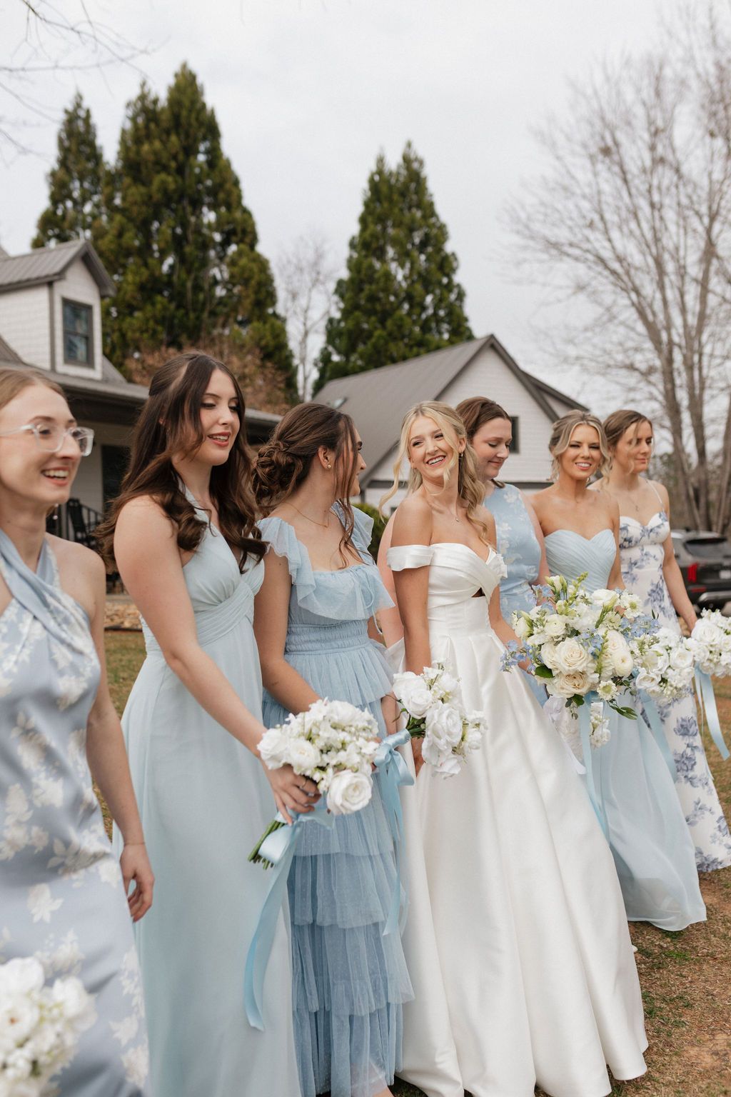 Bridesmaids posing together outdoors during mountain wedding weekend near Asheville