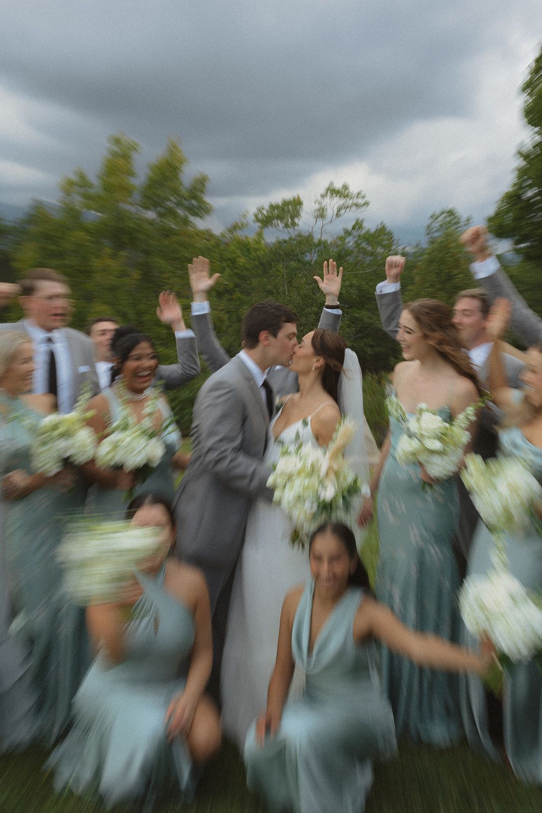 Bridal party celebrating together outdoors during mountain wedding weekend in North Carolina