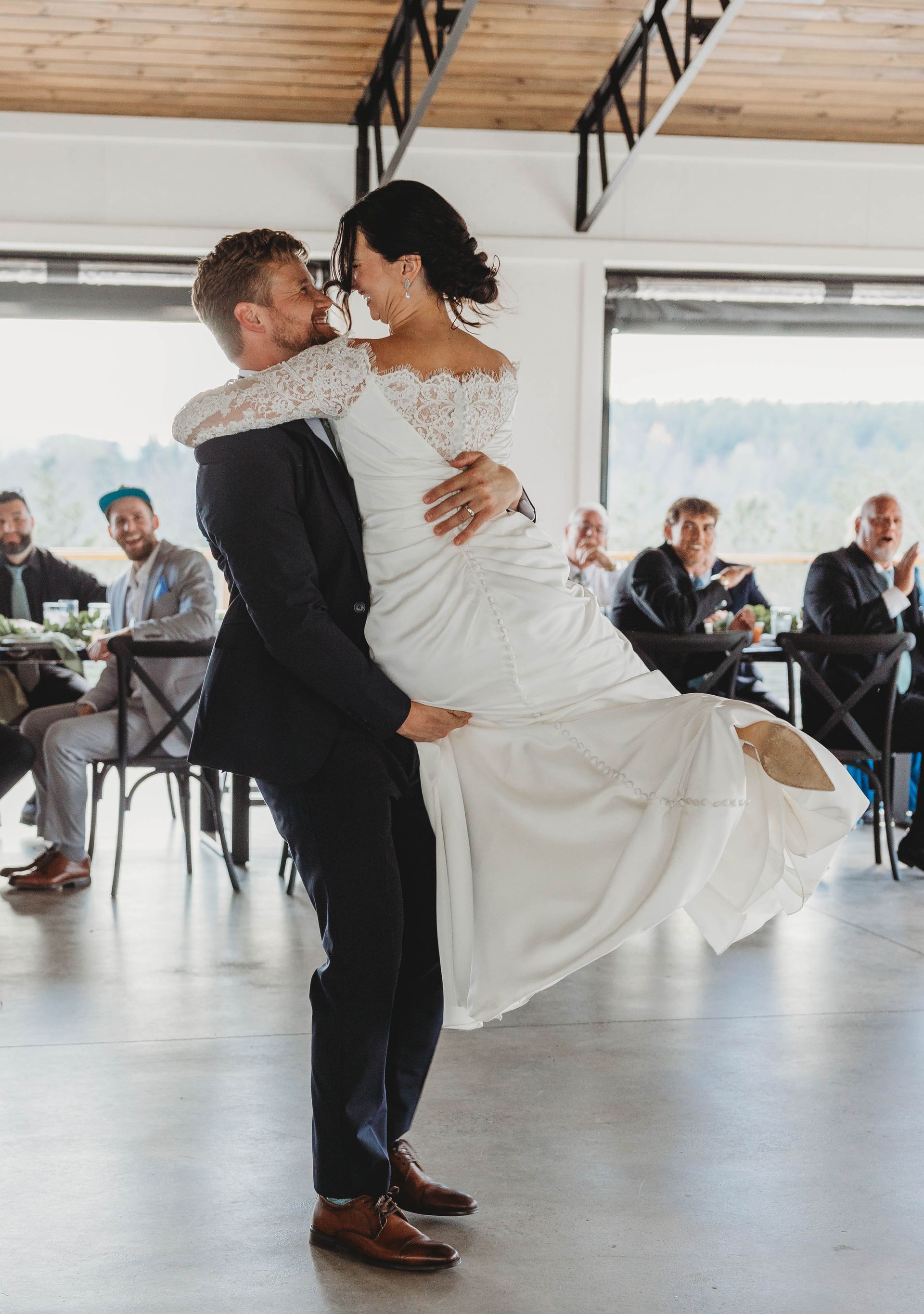 Bride and groom dancing during wedding reception in open-air pavilion near Asheville