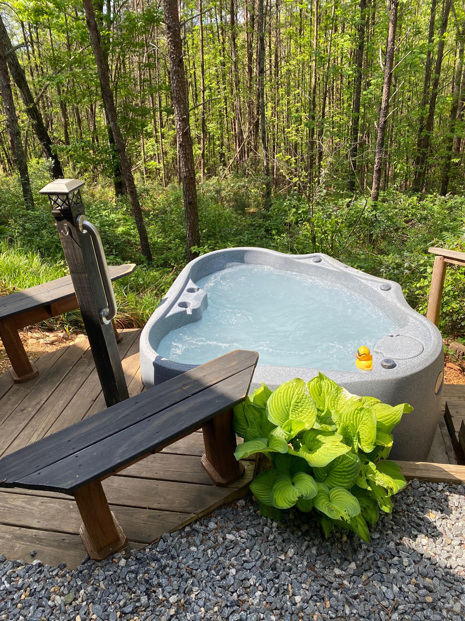 Cabin F exterior with private hot tub at Serenity Ridge wedding venue lodging