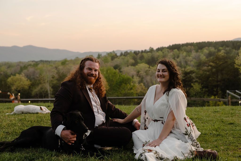 Bride and groom laughing together with panoramic mountain backdrop at North Carolina wedding venue