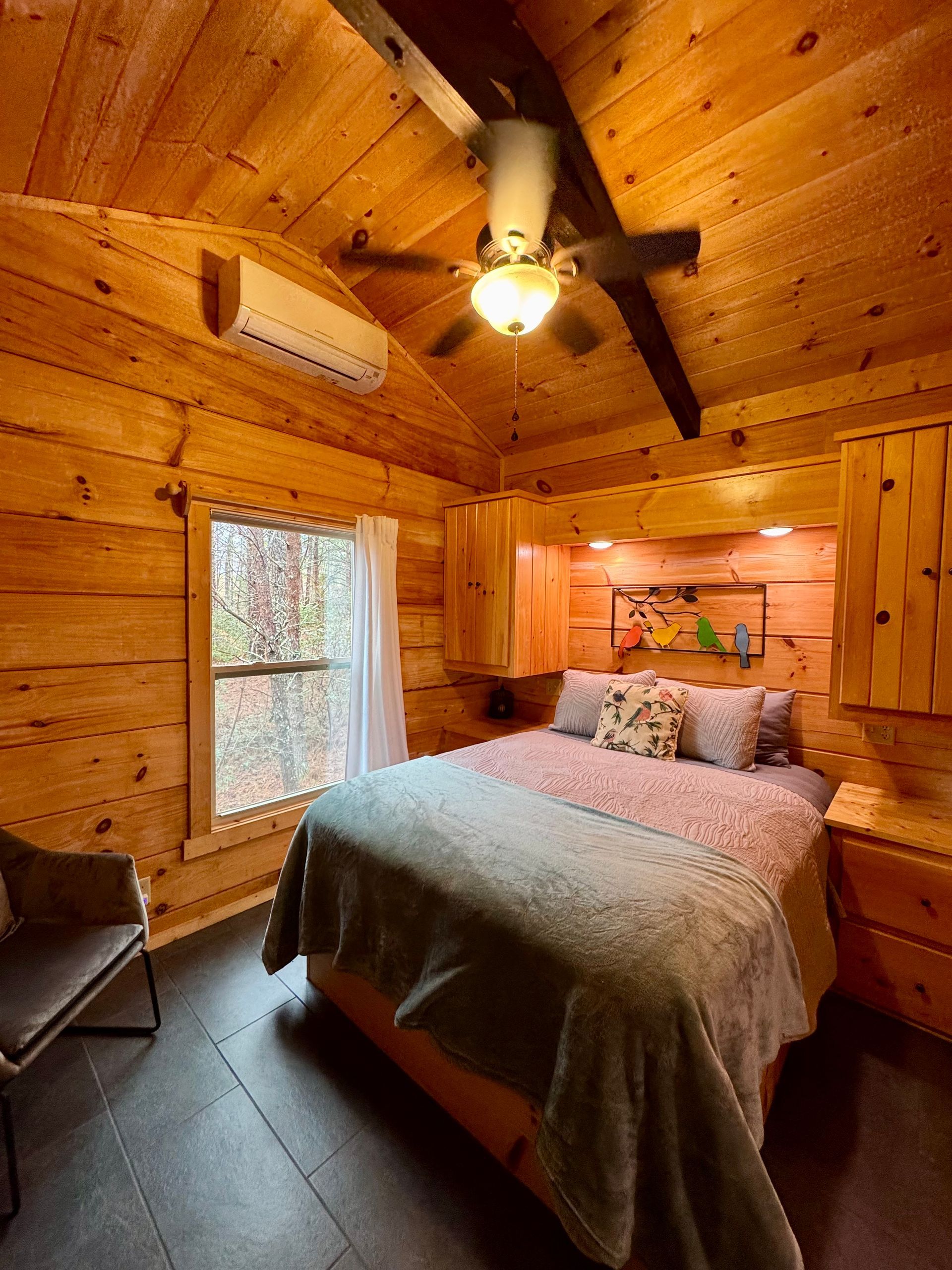 Cozy bedroom in Cabin B at Serenity Ridge for wedding weekend guests