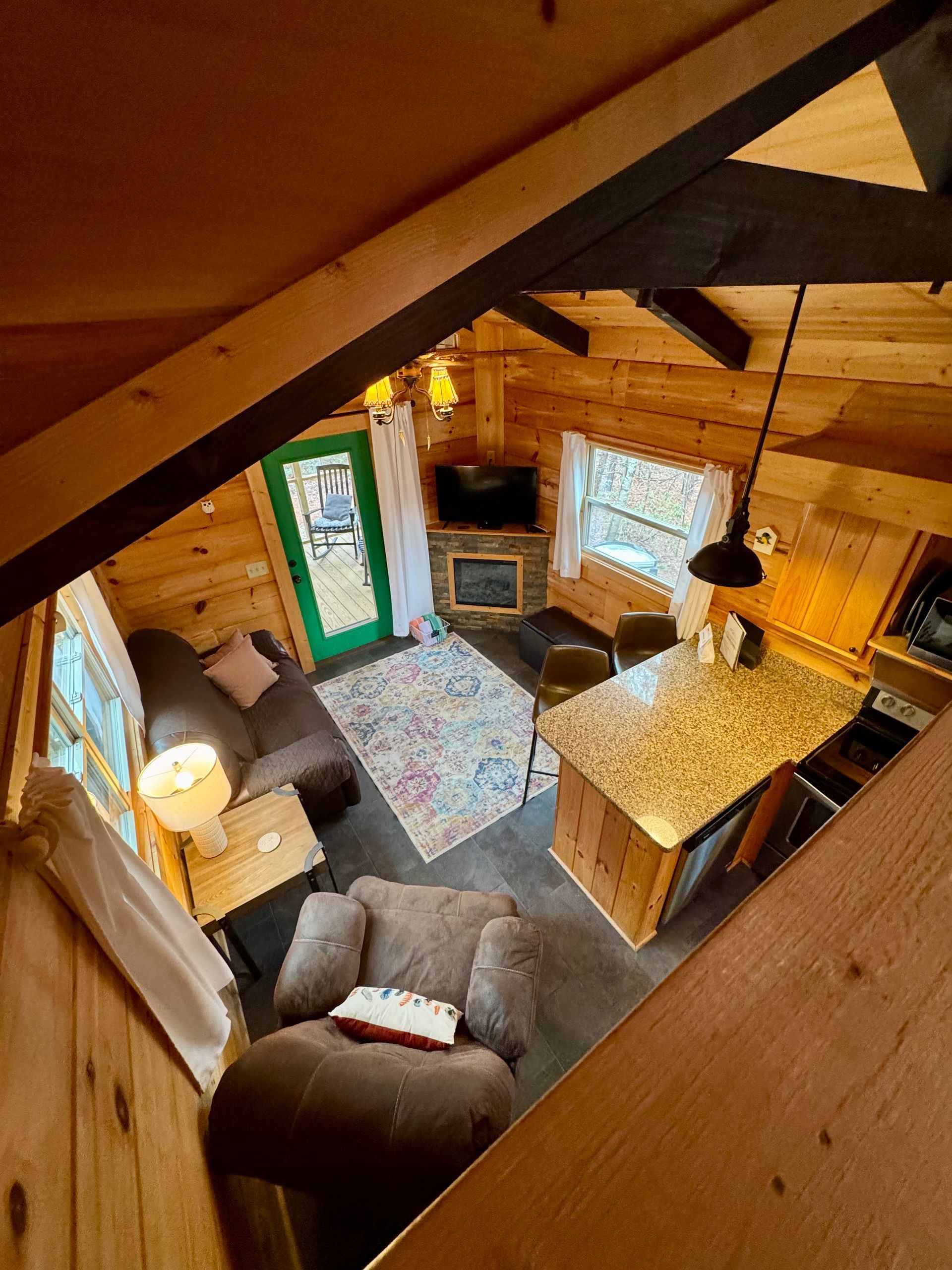View of living room from loft in Cabin B at Serenity Ridge mountain wedding lodging