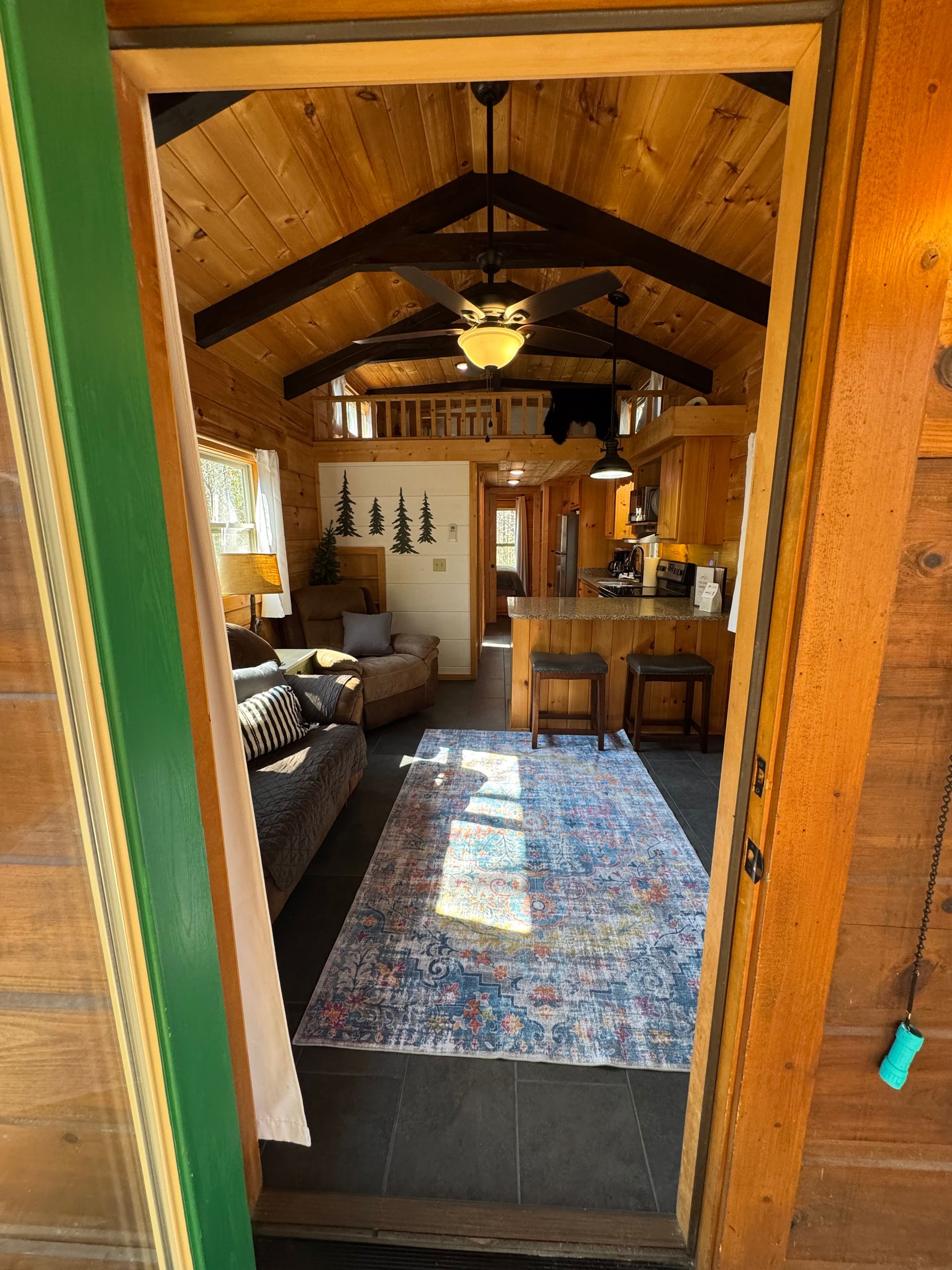 View from front door into living room and kitchen in Cabin C at Serenity Ridge