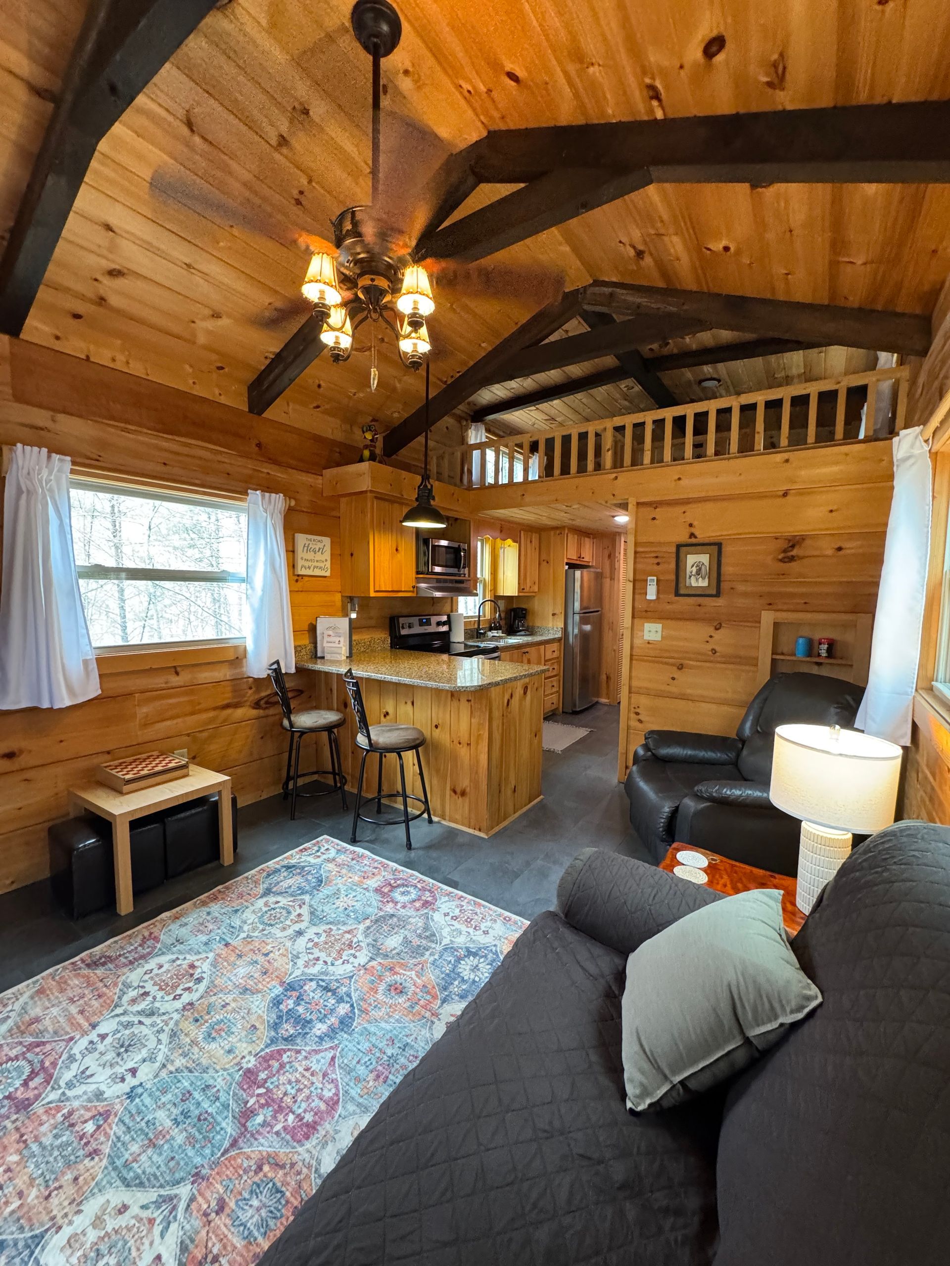 Living room inside Cabin D for relaxing during a wedding weekend at Serenity Ridge