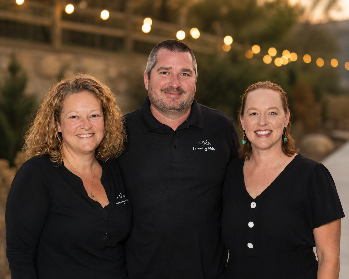 Four owners posed in front of NC Mountains at Serenity Ridge