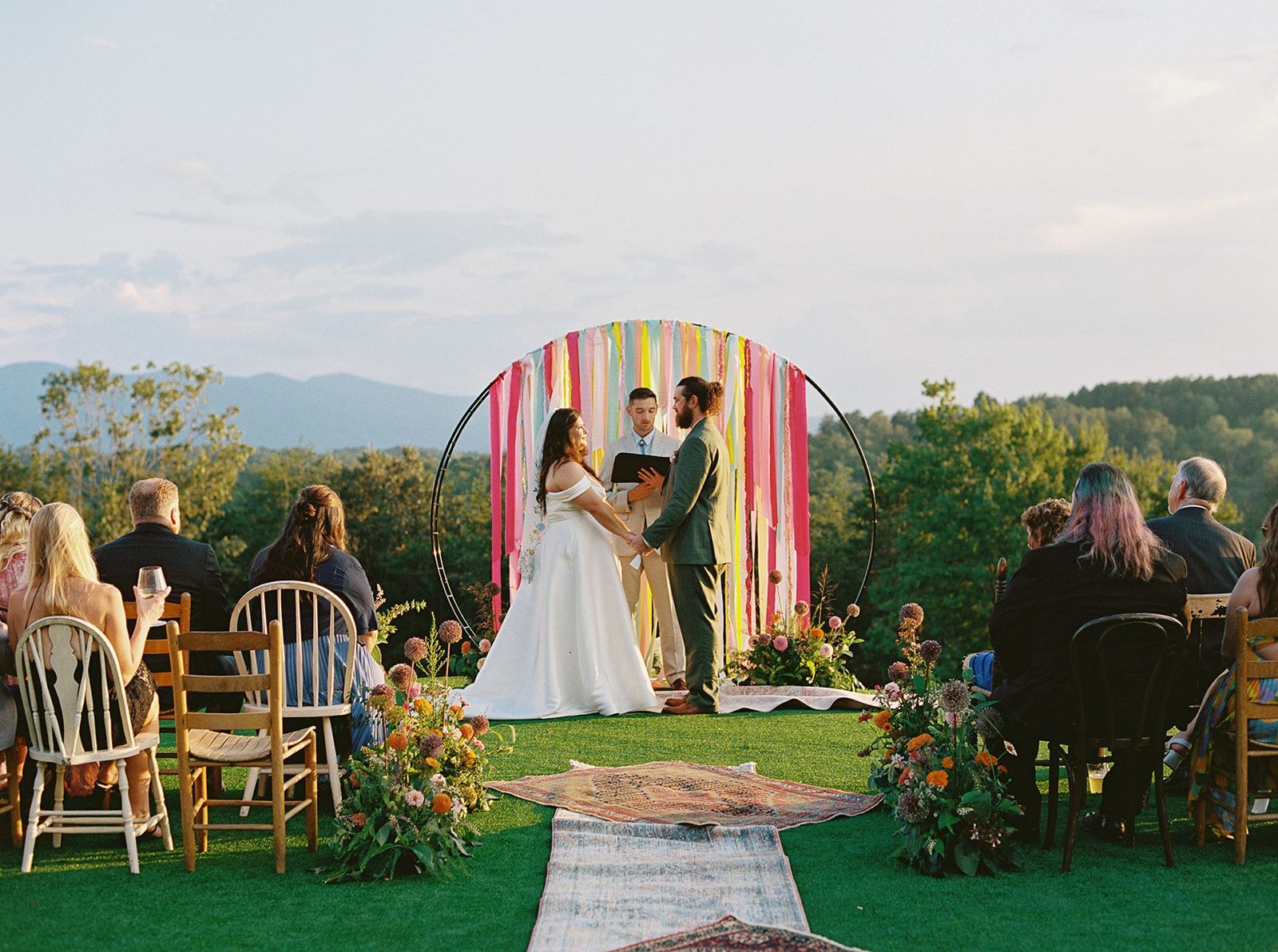 Colorful outdoor wedding ceremony design with mountain backdrop near Asheville, North Carolina