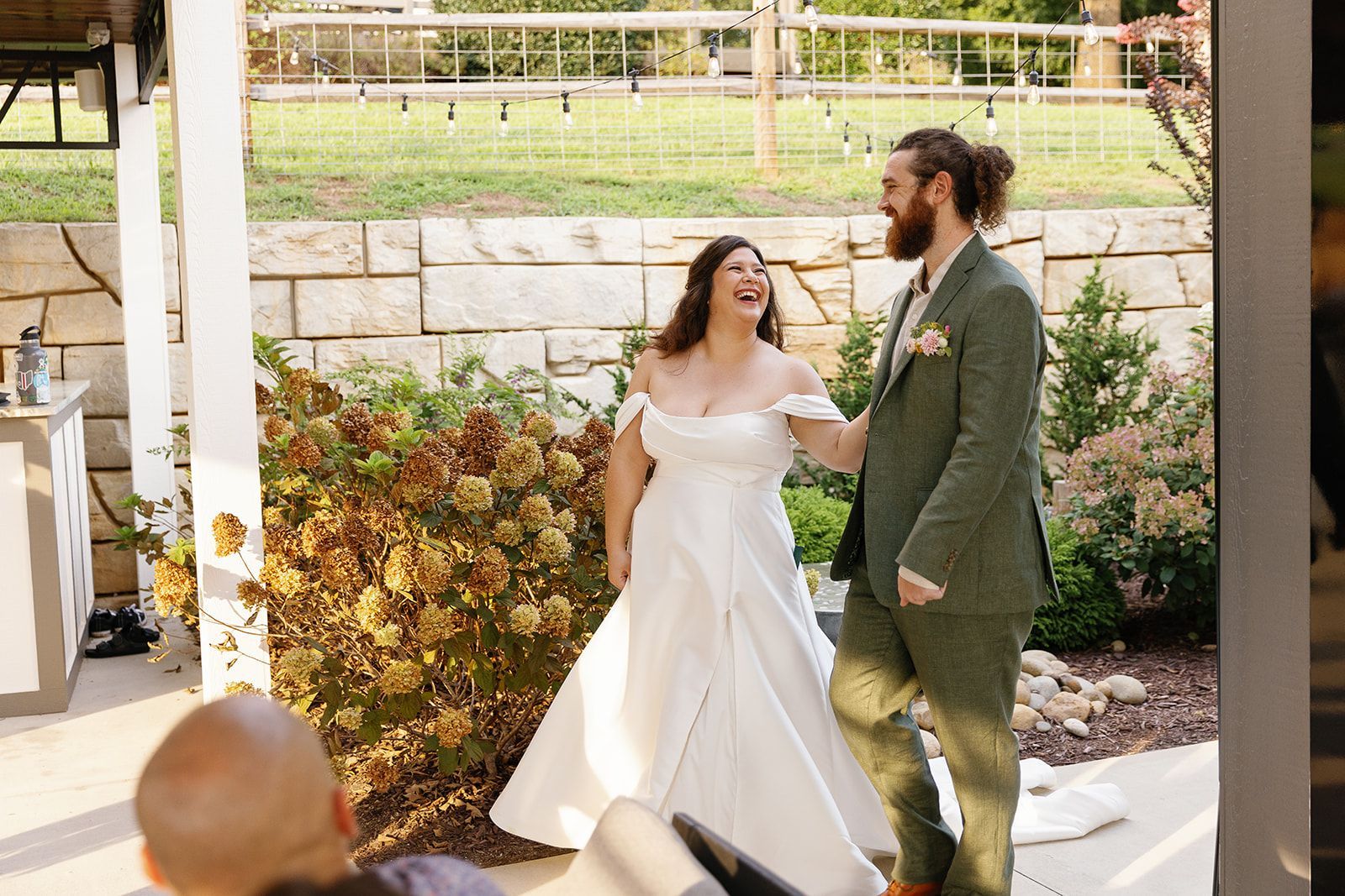 Bride and groom walking together during golden hour wedding portraits at Blue Ridge venue
