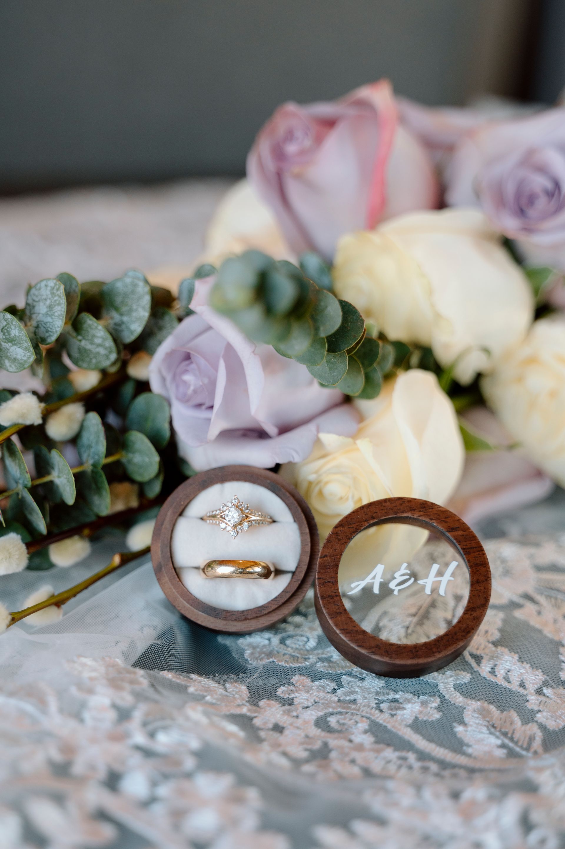 Wedding rings and bridal bouquet detail photographed during getting ready at mountain wedding venue