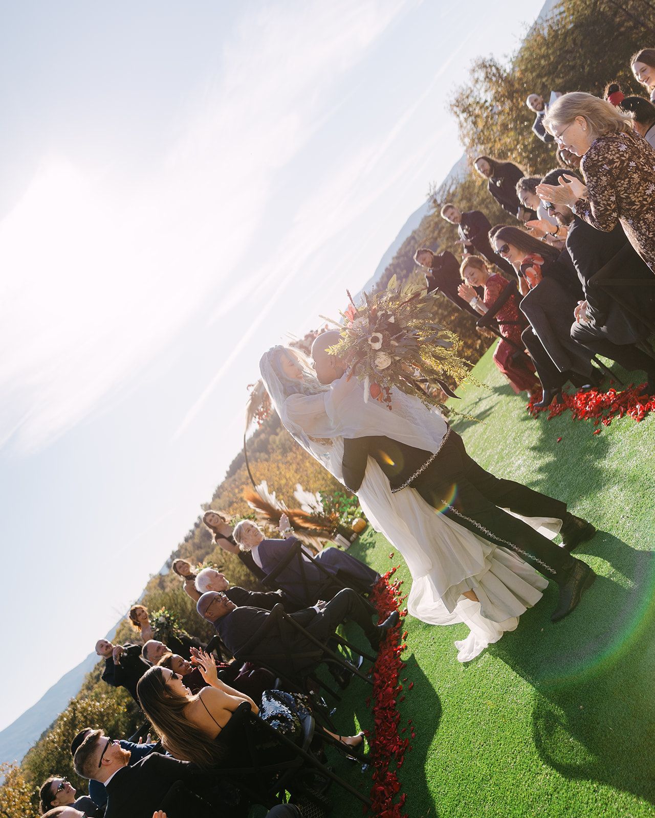 Wedding guests seated for outdoor ceremony overlooking mountain views at North Carolina venue