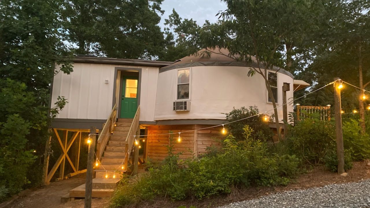 Exterior of the Glamping Yurt at Serenity Ridge at dusk