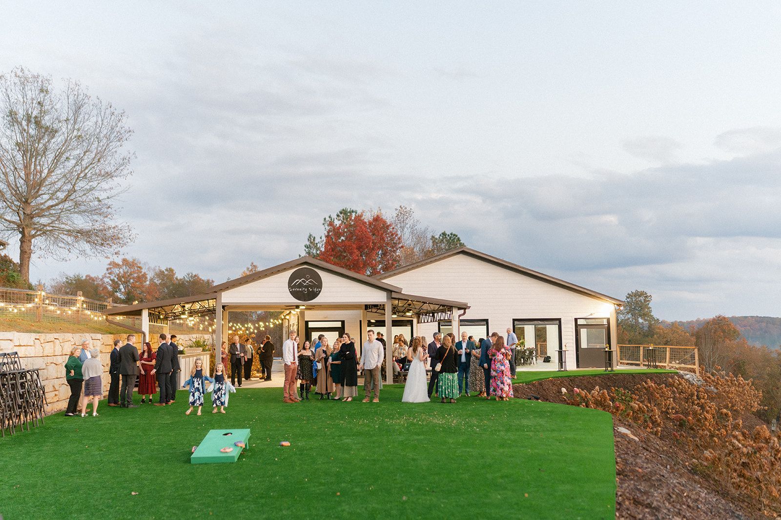 Outdoor wedding ceremony setup with guests gathered at mountain venue near Lake Lure in North Carolina