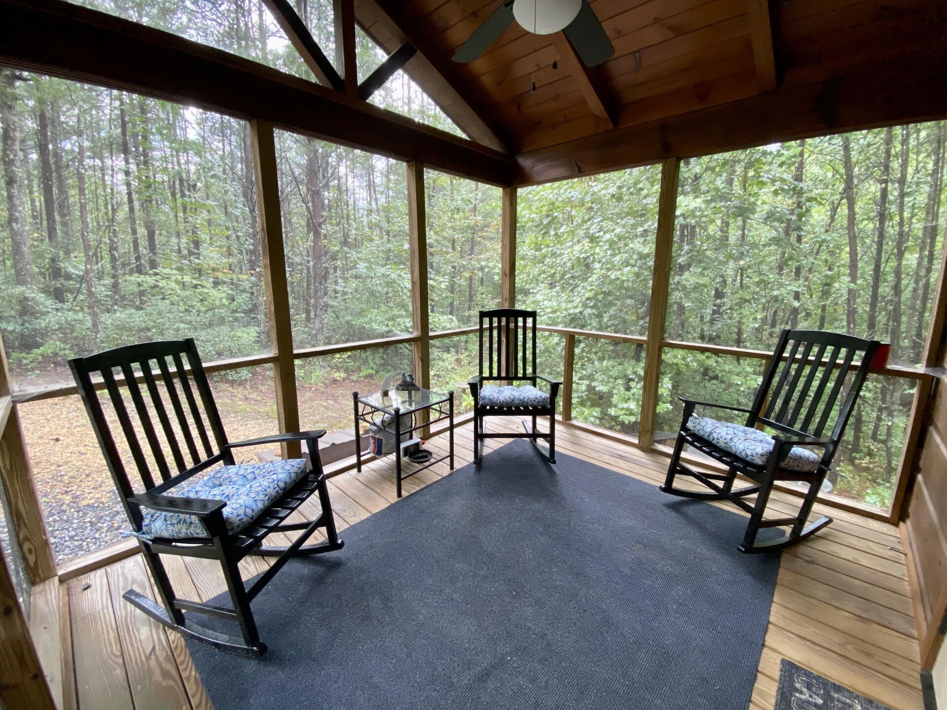 Porch at Cabin B surrounded by trees at Serenity Ridge wedding venue