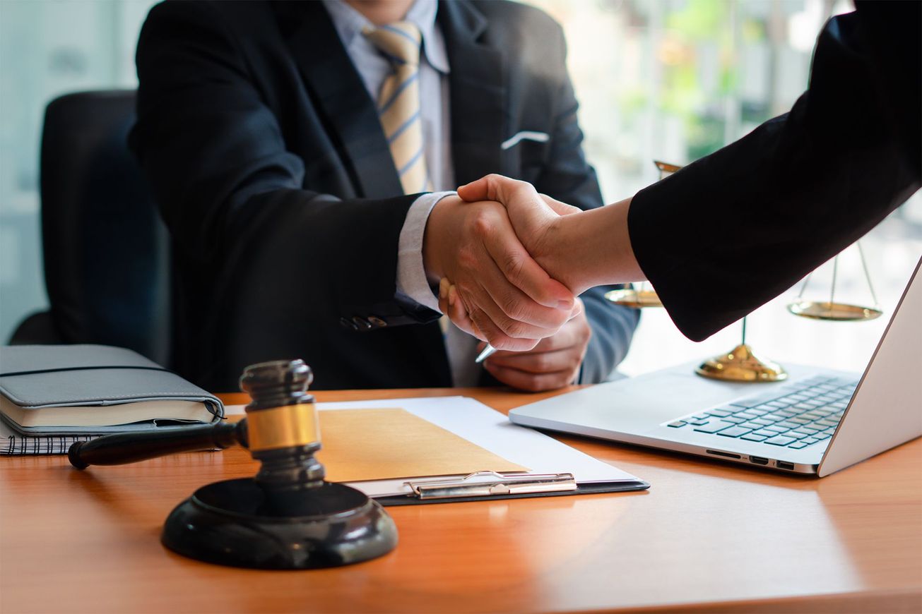 lawyer and client shaking hands