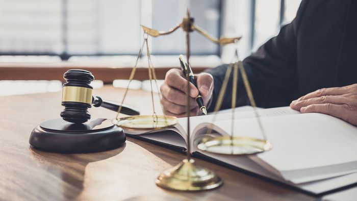 lawyer signing a document