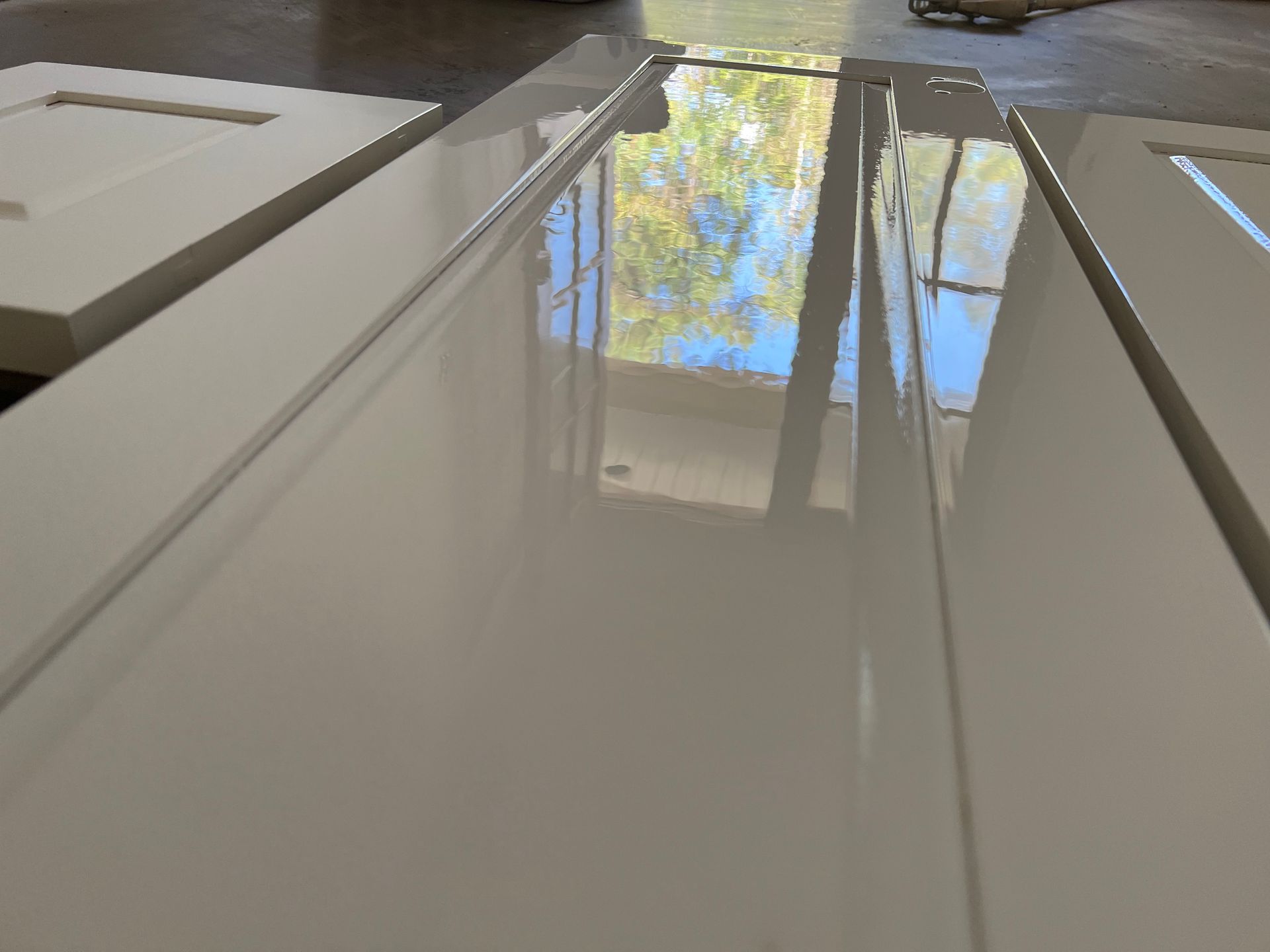 white cabinets with factory finish by Jordan's Painting