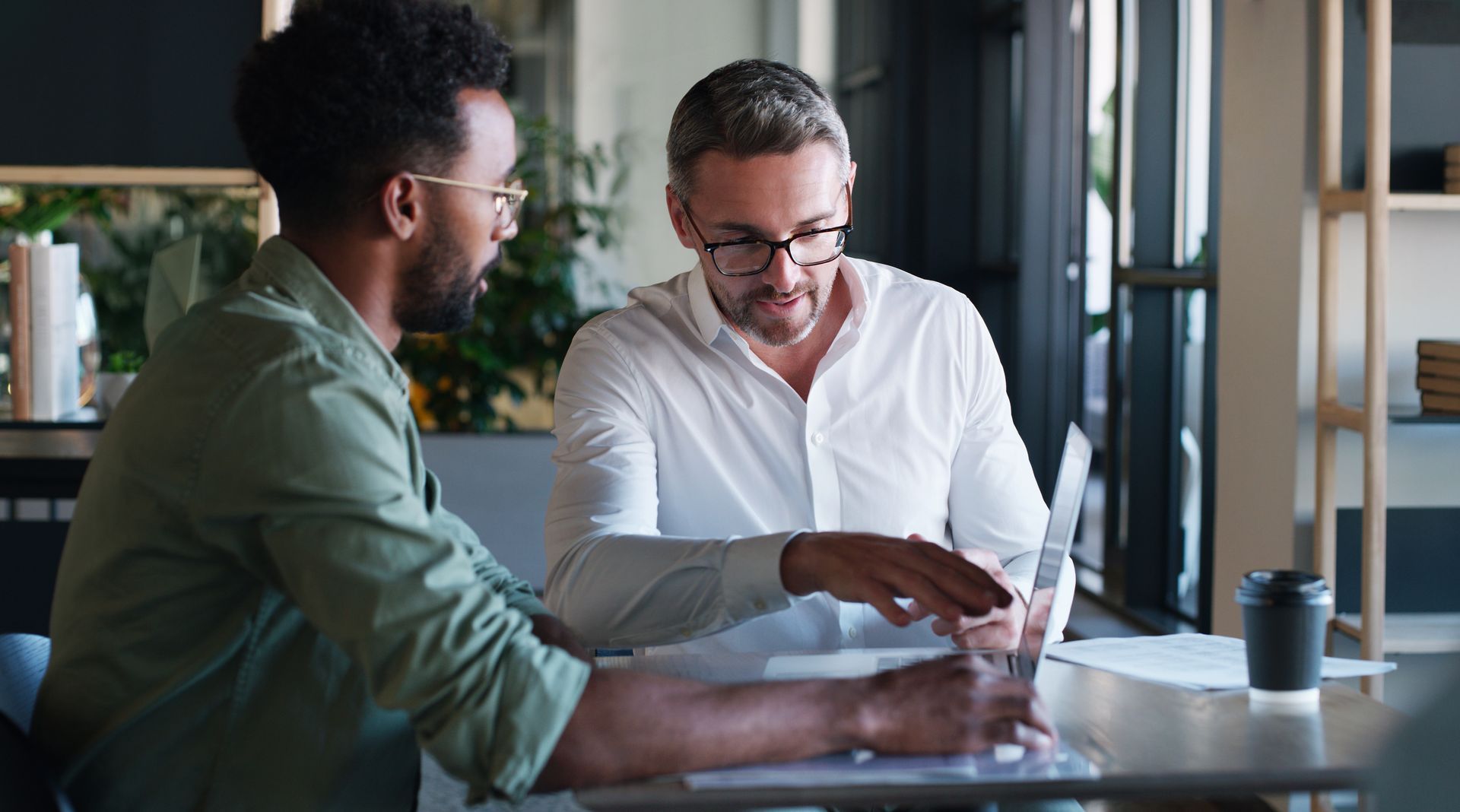 A founder and colleague reviewing a website together
