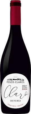 Wine bottle with a white label, the bottle is dark with a red top. The label has text, 'Pegos Claros' and 'Claro'.