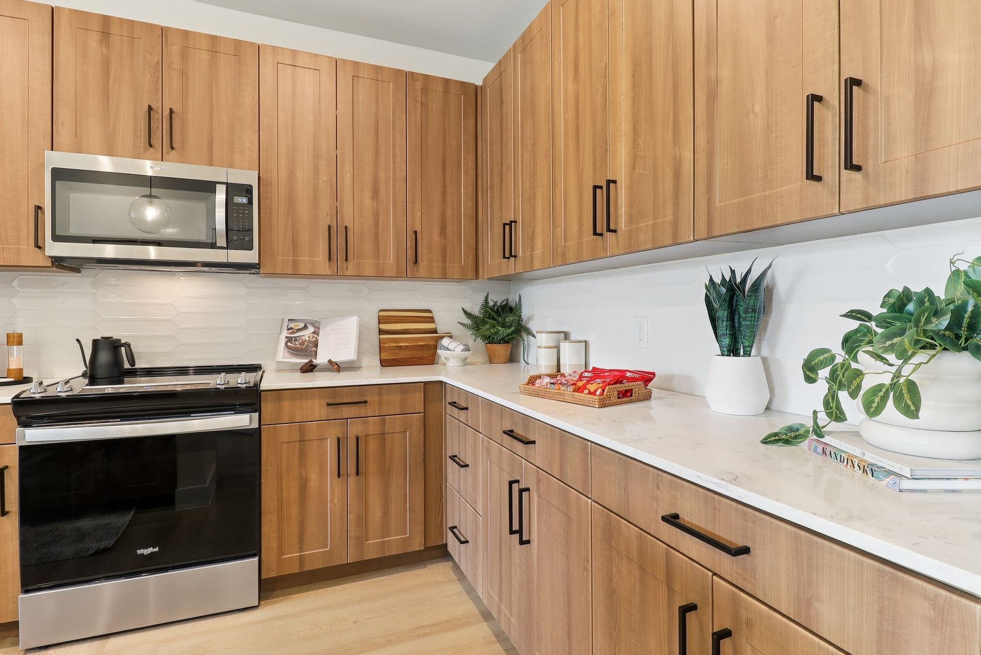 A kitchen with wooden cabinets and stainless steel appliances.