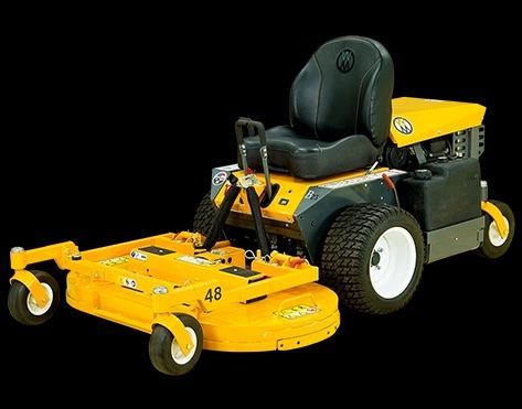 A Green Lawn Mower Is Sitting On Top Of A Lush Green Lawn — Whitsunday Mowers In Proserpine, QLD