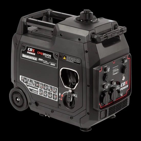 A Red Portable Generator Is Sitting In The Grass — Whitsunday Mowers In Airlie Beach, QLD