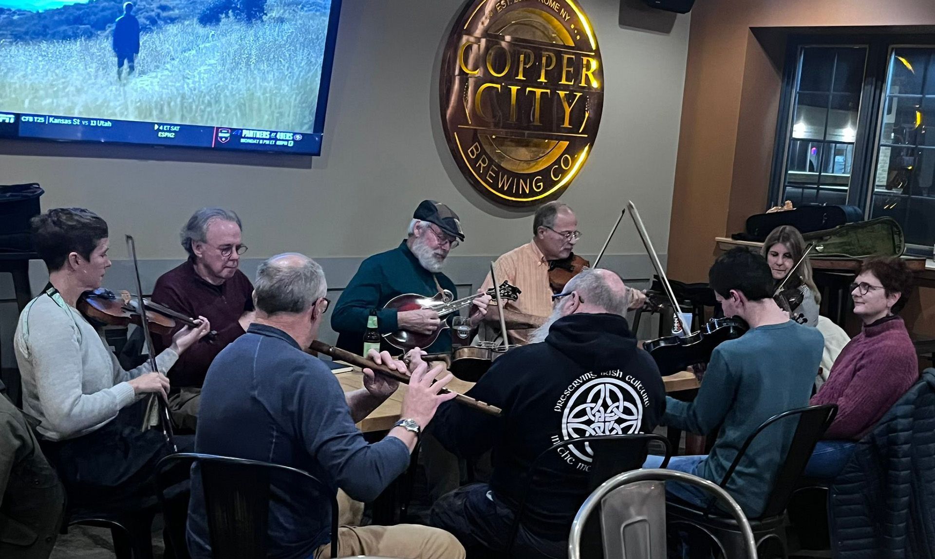 People seated around a table in a bar,