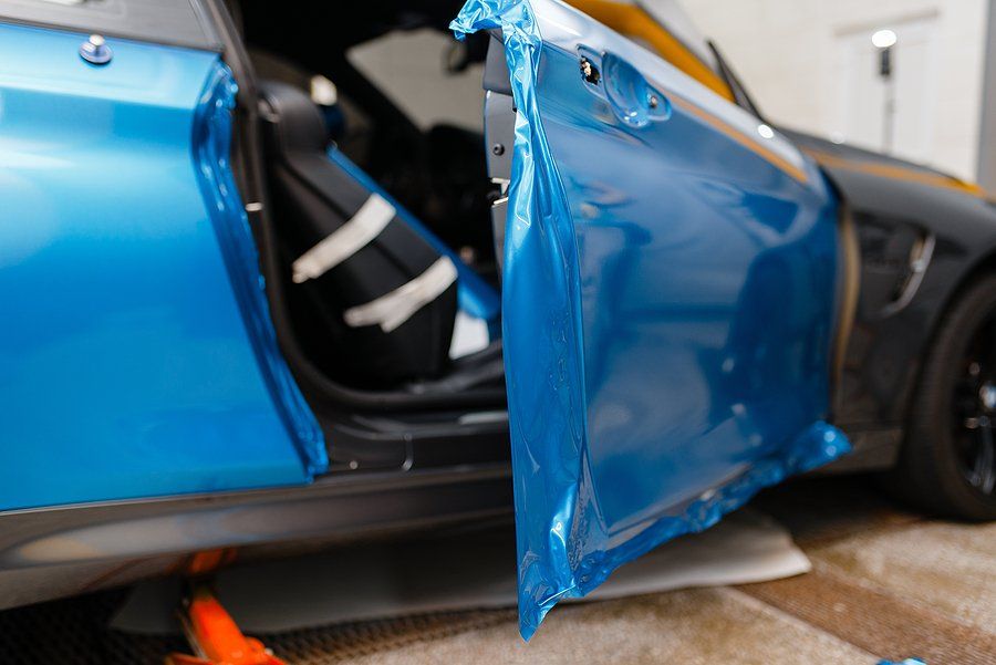 vinyl car wrap being installed