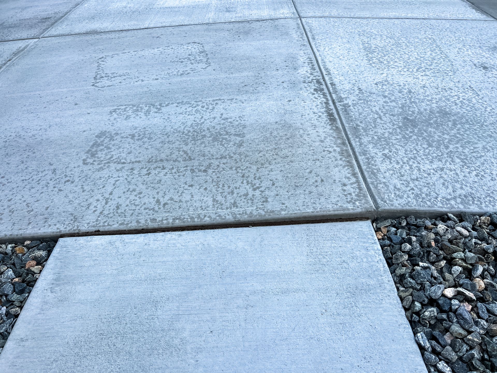 Uneven concrete sidewalk and driveway issues.