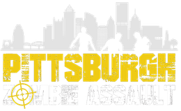 Pittsburgh Zombie Assault logo. Yellow text over silhouette of Pittsburgh skyline with zombies.