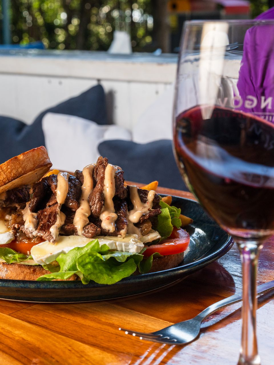 Flaming deal at Chop n Chill. Two main meals + bottle of wine for $75, Wednesdays and Thursdays from 5 PM. BBQ chicken wings in flames.