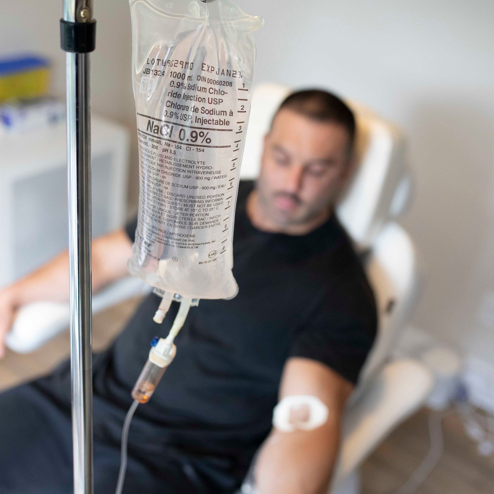 man getting vitamin IV drip