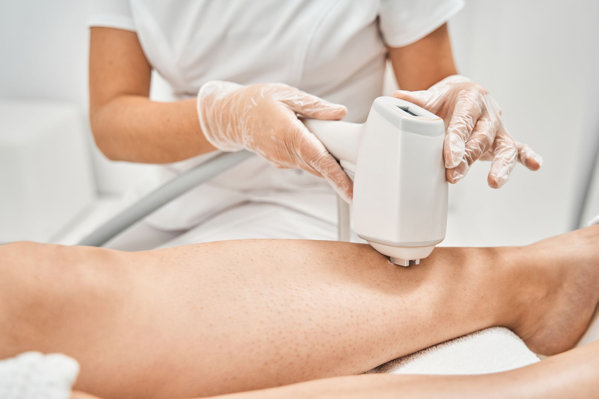 woman getting a laser treatment on face